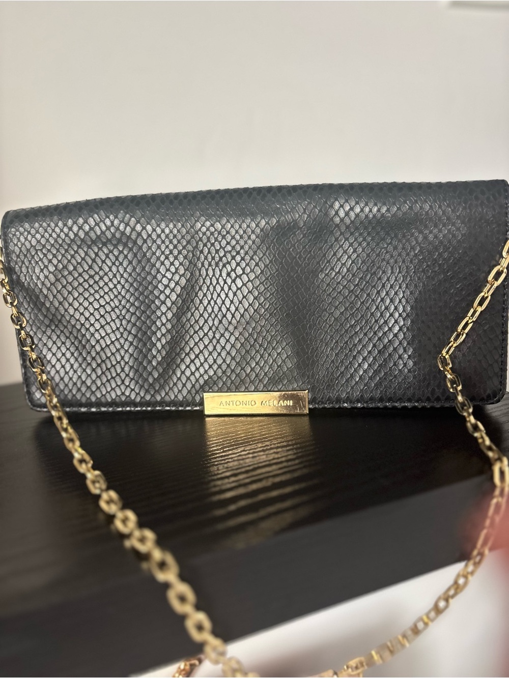 ANTONIO MELANI Black Snake-Embossed Clutch with Gold Chain